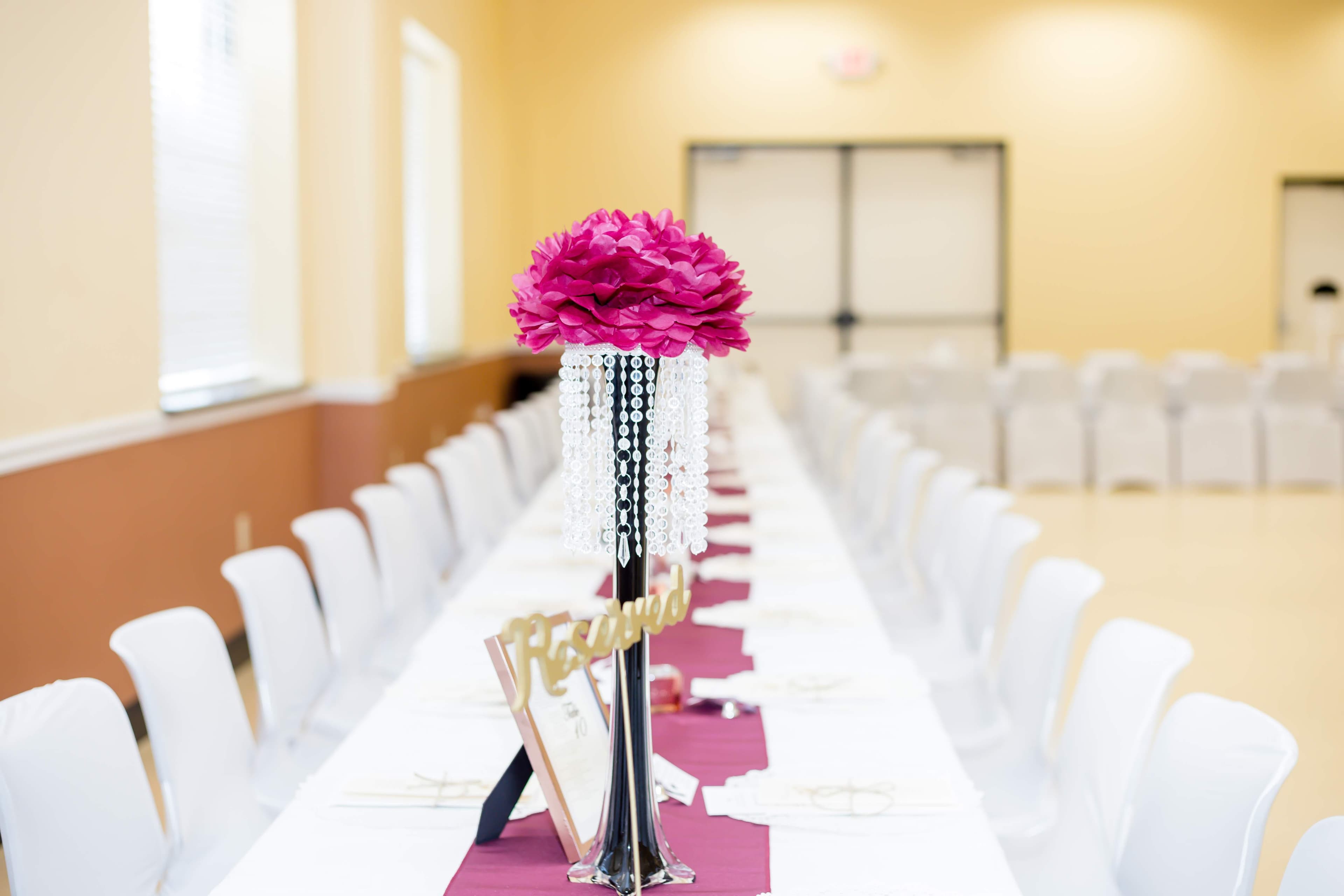 Refined event tablescape with elegant floral centerpiece